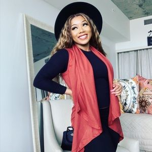 Super cute versatile vest. Cute with turtle neck or a tank.